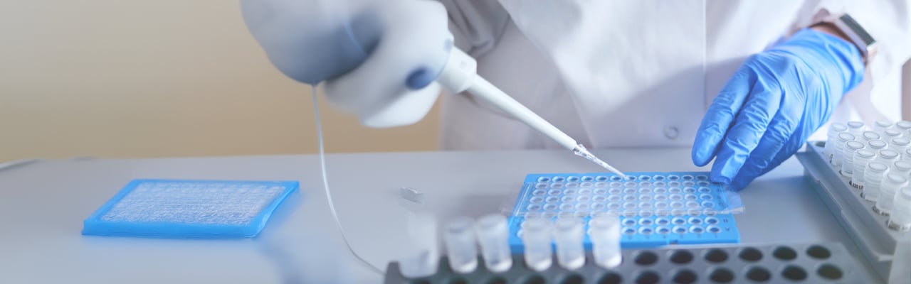 hero bg-3233_Laboratory scientist working at lab with micropipette, and 96 well plate