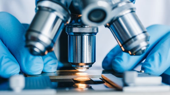 3212_Close-up shot of microscope with metal lens at laboratory