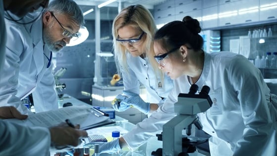 2775_Team of Medical Research Scientists Work using Microscope (1)