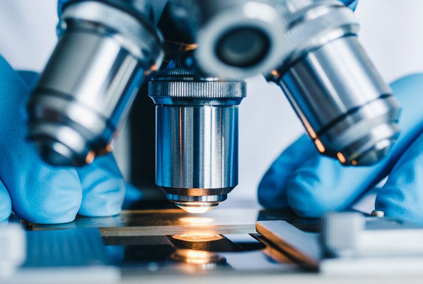 3212_Close-up shot of microscope with metal lens at laboratory cropped