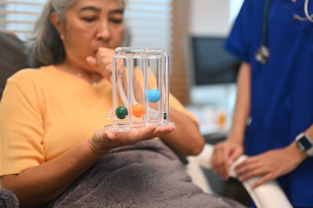 Website Featured Image_PNG-4849_Woman using a spirometer
