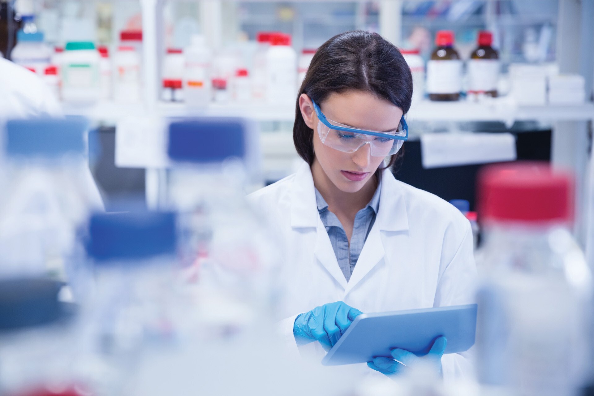 Laboratory woman using computer tablet